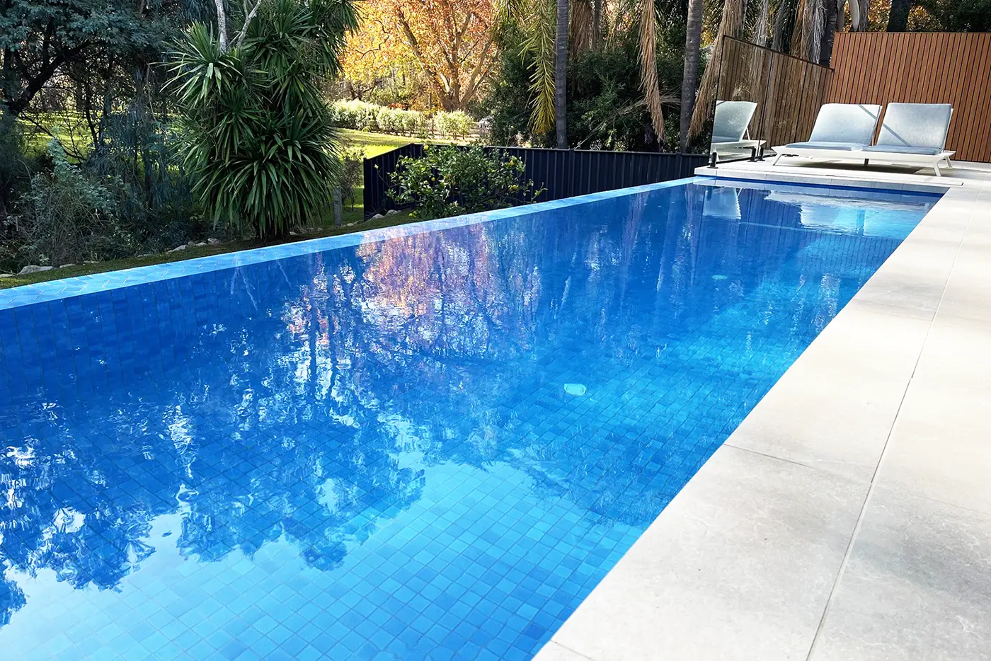 Small rectangle pool with infinity edge along one side. Small rectangle pool with infinity edge along one side.