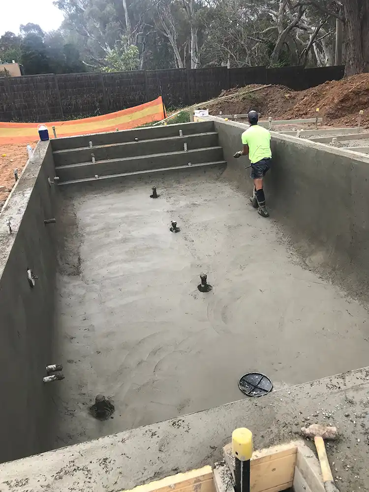 Completed concrete swimming pool shell with smooth finish Concrete swimming pool construction