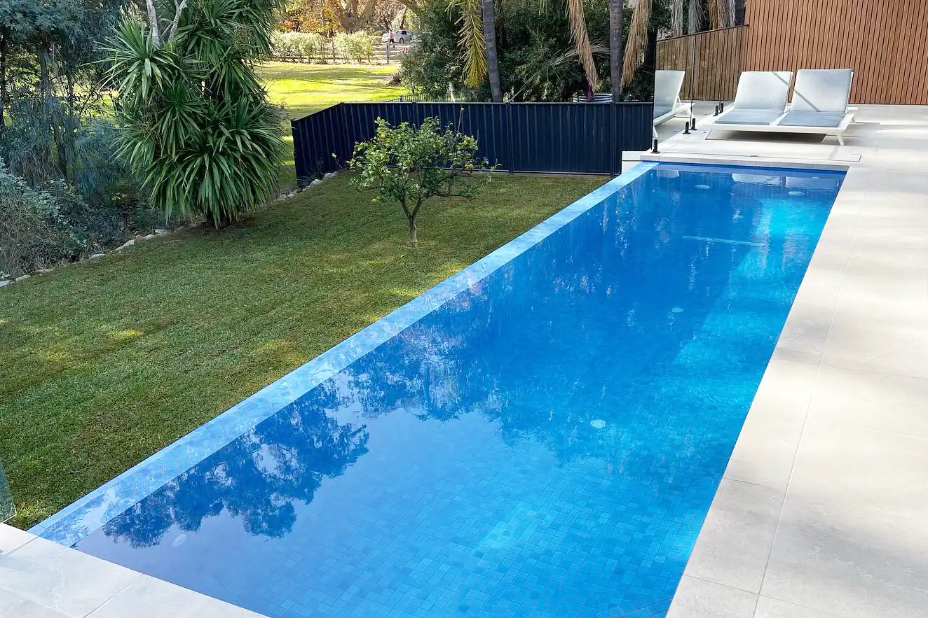 Small rectangle pool with infinity edge along one side. Small rectangle pool with infinity edge along one side.