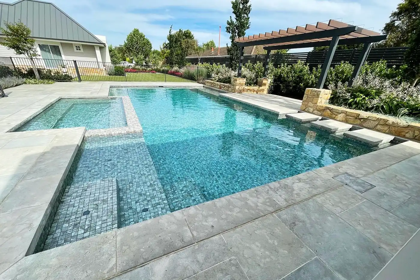 Large family pool with spa featuring stepping stones Concrete Swimming Pools Shepparton, large family pool with spa, featuring stepping stones